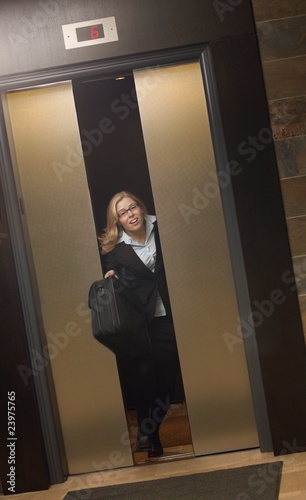 Photo: Late For Work-Getting Off Elevator Late For Work-Getting Off Elevator