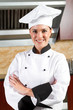 beautiful female chef portrait in kitchen