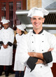 young european chef with colleagues