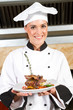 female chef presenting food