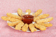 plate of chicken fingers with BBQ sauce