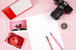 Clutter of objects stacked on pink background Clutter of objects stacked on pink background