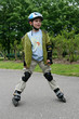 Preschooler learning to ride on rollerblades