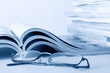 Open journals with glasses