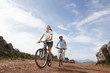 Couple riding bikes together