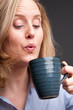 Woman drinking from mug