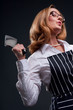 Photo: Female butcher holding meat cleaver Female butcher holding meat cleaver