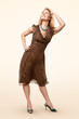 Full-length woman wearing brown dress