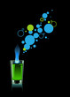 Glass of absinthe on black background.