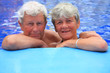 Foto: Senior couple in the swimming pool. Senior couple in the swimming pool.