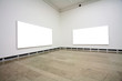 empty frames in a room against a white wall .