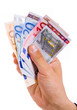 man hand with euro bills over white background