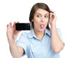 Enjoyment - Funny young woman taking self photograph with her mo