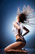 Foto: Young sexy woman with fluttering hair Young sexy woman with fluttering hair