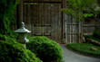 Medieval Street lamp and old gate