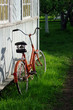 Red old bicycle near old wooden wall Red old bicycle near old wooden wall