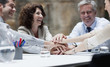 Business people stacking hands in meeting