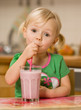 little girl with smoothie