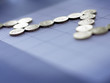 Close up of pound coins forming graph
