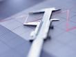 Close up of vernier caliper on graph