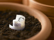 Roll of twenty pound notes growing in flowerpot