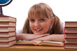 Schoolgirl is sitting on the stack of book and reading. Schoolgirl is sitting on the stack of book and reading.