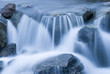 Close up of blurred water rushing in stream