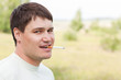 closeup man smokes a cigarette