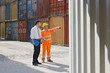 Photo: businessman and manual worker with cargo containers businessman and manual worker with cargo containers
