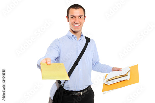 Photo: A postman delivering mail isolated on white background A postman delivering mail isolated on white background