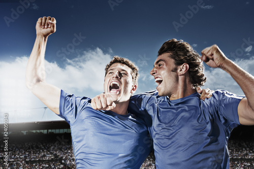 Photo: Soccer players cheering Soccer players cheering