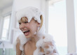 Woman covered in soap suds