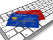 Illustration: Credit cards on a computer keyboard Credit cards on a computer keyboard