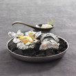 potatoes with horseradish sauce cooked in aluminium foil on coals