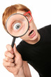 Excited nerd with magnifying glass Excited nerd with magnifying glass