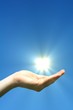 hand sun and blue sky