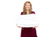 Smiling woman holding white towels Smiling woman holding white towels