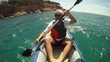 Man paddling in Kayak on the sea