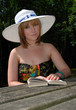 Pretty woman outdoors with book Pretty woman outdoors with book