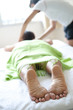 Woman receiving body massage by masseur