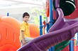 Young boy at colorful outdoor playground
