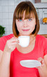 young woman enjoying a cup of coffee