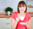 young woman enjoying a cup of coffee