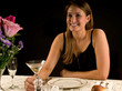 Foto: Young woman enjoying martini in restaurant or dining room Young woman enjoying martini in restaurant or dining room