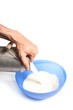 pouring milk into a bowl