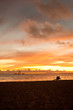 Bright sunrise in early morning with sand beach and ocean Bright sunrise in early morning with sand beach and ocean