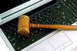 Gavel on a laptop computer close up