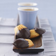 madeleines half coated with chocolate