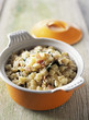 casserole dish of crozets,raw ham and sage