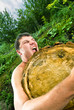 young man, which raises huge log